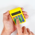 Hands holding a pocket digital calculator on white background Royalty Free Stock Photo