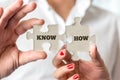 Hands Holding Puzzle Pieces for Know How Concept Royalty Free Stock Photo