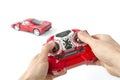 hands holding a radio remote control controller of a toy car Royalty Free Stock Photo