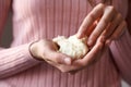 Hands holding raw shea butter or karite