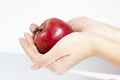 Hands holding red apple Royalty Free Stock Photo
