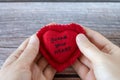 Hands holding red heart with handwritten Bible verse guard your heart Royalty Free Stock Photo