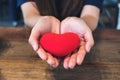 Hands holding a red heart sign Royalty Free Stock Photo