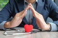 Hands holding Red heart and stethoscope Royalty Free Stock Photo