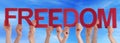 Hands Holding Red Straight Word Freedom Blue Sky Royalty Free Stock Photo