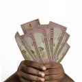 hands holding 5000 Rwandan franc notes. closeup of Hands holding Rwandan currency notes