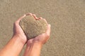 Hands holding a sand in form of heart Royalty Free Stock Photo