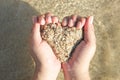 Hands holding a sand in form of the heart Royalty Free Stock Photo