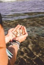 Hands holding shells caught from the sea Royalty Free Stock Photo
