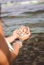 Hands holding shells caught from the sea Royalty Free Stock Photo