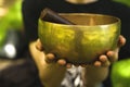 Hands holding a singing bowl Royalty Free Stock Photo