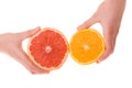 Hands holding sliced orange and grapefruit Royalty Free Stock Photo