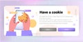 hands holding smartphone and cookie protection of personal information internet web pop up we use cookies policy