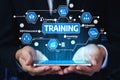 Hands Holding Smartphone with Digital Training Icons and E-Learning Concept for Skill Enhancement and Knowledge Royalty Free Stock Photo