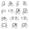 Hands holding smartphone and tablet icon set. Thin line style stock vector. Royalty Free Stock Photo
