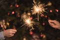 Hands holding sparklers