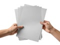 Hands holding a stack of gray paper sheets Royalty Free Stock Photo