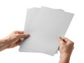 Hands holding a stack of light gray sheets of paper Royalty Free Stock Photo