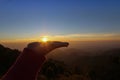 Hands holding the sun at sunrise Royalty Free Stock Photo
