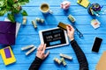 Hands holding tablet and credit card on blue wooden table with money, Cyber monday, free Royalty Free Stock Photo