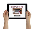 Hands holding tablet with digital nomad concept on screen Royalty Free Stock Photo