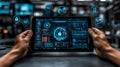 Hands holding tablet with futuristic security interface and digital elements Royalty Free Stock Photo