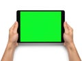 Hands holding tablet with green screen isolated on white background Royalty Free Stock Photo