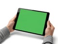 Hands holding tablet with green screen isolated on white background Royalty Free Stock Photo