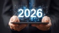Hands holding tablet presenting 2026 digital technology future network Royalty Free Stock Photo