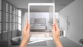 Hands holding tablet showing bathroom, notebook with blueprint sketch in the background, augmented reality concept, application to