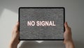 Hands holding tablet showing no signal screen Royalty Free Stock Photo