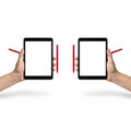 Hands holding tablets with styluses Royalty Free Stock Photo