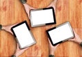 Hands Holding Three Digital Tablet Computers