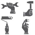 Hands holding tools Royalty Free Stock Photo