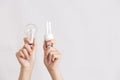 Hands holding traditional and energy efficient light bulbs Royalty Free Stock Photo