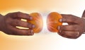 Hands holding two mandarins Royalty Free Stock Photo