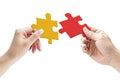 Hands holding two matching jigsaw pieces Royalty Free Stock Photo