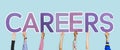 Hands holding up purple letters forming the word careers Royalty Free Stock Photo