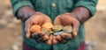 Hands holding various colored coins, symbolizing diverse financial access and inclusivity in fintech solutions.GenerativeAI