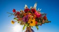 Hands holding a vibrant bouquet of wildflowers on a bright blue sky background. Generative AI Royalty Free Stock Photo