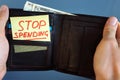 Hands holding wallet with stick Stop spending. Royalty Free Stock Photo