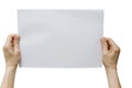 Hands holding a white sheet of paper