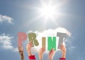 Hands holding word Print against bright sunlight