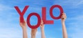 Hands Holding Yolo in the Sky