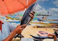 Hands holdong tuna fish at seafood market Royalty Free Stock Photo