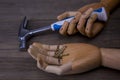 Hands holds a hammer and nails Royalty Free Stock Photo