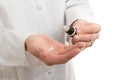 Hands with homeopathic pills and bottle Royalty Free Stock Photo