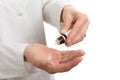 Hands with homeopathic remedy and bottle Royalty Free Stock Photo