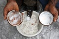 Hands of Indigenous Fijian man husking a coconut fruit in Fiji Royalty Free Stock Photo