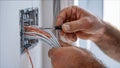 Electrician wiring new construction for modern home Royalty Free Stock Photo